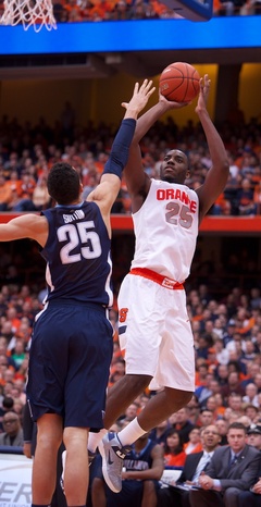 Syracuse forward Rakeem Christmas (25) hits a fadeaway jumper over Villanova's Maurice Sutton (25).