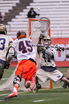 Randy Staats attempts a shot on Notre Dame goalie Shane Doss. 