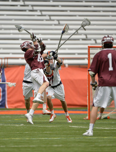 Two Syracuse defenders defend a Colgate shot. The SU defense was particularly stingy throughout the contest.