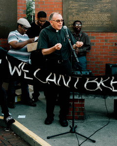 Attendants at a Black Lives Matter rally held in Syracuse downtown the day following a white supremacist rally in Charlottesville, Virginia, that ended with a car plowing through a group of counterprotesters and killing Heather Heyer.