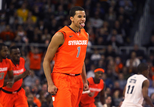 Michael Carter-Williams celebrates during Syracuse's 72-66 win over Providence on Wednesday. Carter-Williams finished the game with 17 points, six rebounds and six assists.