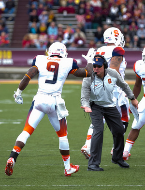 Brisly Estime and SU head coach Scott Shafer celebrate during the Orange's 40-3 victory over Central Michigan on Saturday. 