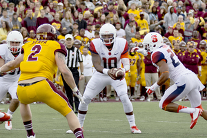 Terrel Hunt scans the Central Michigan defense on Saturday. Hunt ran for three touchdowns and threw for another score in his first full game of the season.