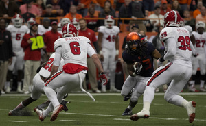 Prince-Tyson Gulley cuts upfield against N.C. State. He'll be honored on Senior Day along with his teammates before they play their last game in the Carrier Dome on Saturday. 