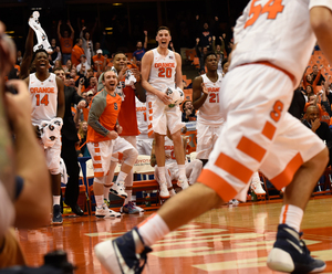 Syracuse players jump up and down as they watch the walk-ons play in the final minutes of a 22-point win over Montana State on Tuesday night.