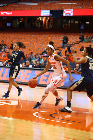 Briana Day attacks the rim offensively while dribbling the ball with her right hand. She finished with 15 points and 10 rebounds.