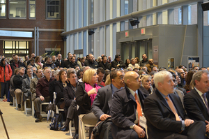 Syracuse University community members listen to Chancellor Kent Syverud's address inside Milton Atrium at the Life Sciences Complex.