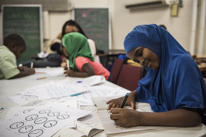 A girl works on math problems during RISE’s after-school program, which runs Monday to Thursday.