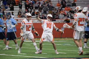 Brendan Curry (No. 10) celebrates after scoring Syracuse's final goal of regulation to tie the game and send it to overtime.