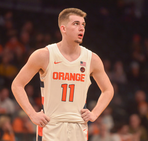 Joe Girard had 12 points and nine assists in the Orange's 14-point loss.