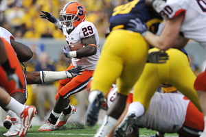 Syracuse running back Antwon Bailey looks for a hole in SU's 'Big' formation in the second quarter Saturday. Bailey rushed for 94 yards in the Orange's 19-14 win.