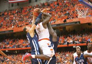 Dion Waiters is swarmed by a slew of Villanova defenders during Syracuse's 83-72 loss Saturday.