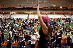 Renee Gardener dances with students at Relay For Life 2012 on Saturday night. Approximately 2,000 people attended this years event, including several representatives from Syracuse University, SUNY-ESF and Upstate Medical University.