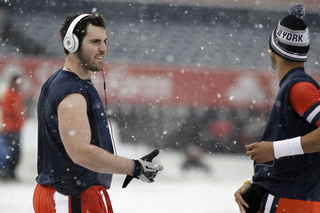 Syracuse warms up before the game. The team takes on West Virginia in the 2012 Pinstripe Bowl at a snowy Yankee Stadium on Saturday, Dec. 29, 2012, in New York City. 