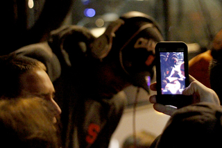 Fans cheer on James Southerland as he exits the bus at the Carmelo K. Anthony Basketball Center. 