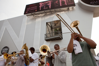 The Brass Connections street performers play outside of The Hudson Grille.