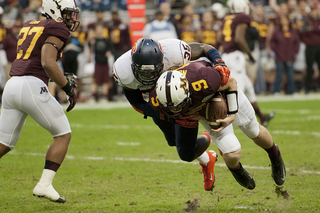 Dyshawn Davis flattens quarterback Philip Nelson.