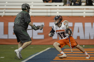 Dylan Donahue operates behind the net, dodging toward the crease. 