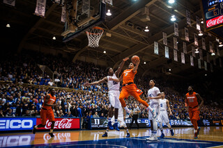 Gbinije goes up for a left-handed layup in the first half against his former team.