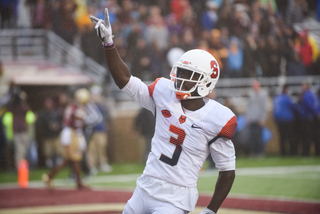 Ervin Philips holds his right hand up to the crowd. Philips scored two first-half touchdowns.