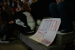 Signs were made a placed amongst the crowd.